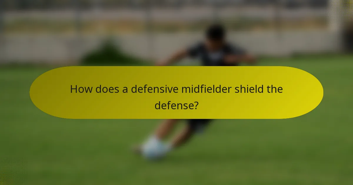 How does a defensive midfielder shield the defense?