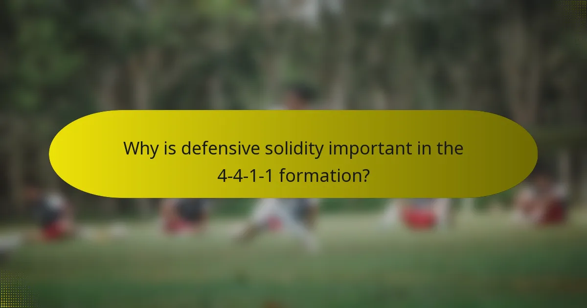 Why is defensive solidity important in the 4-4-1-1 formation?
